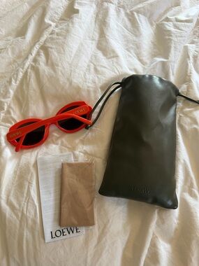 Loewe Bright Red Oval Sunglasses with Black Lenses
